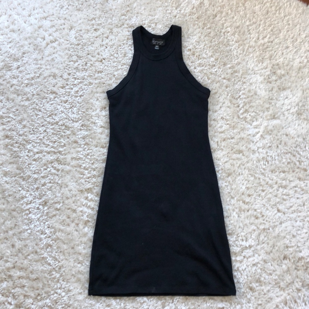 Tight short black dress.